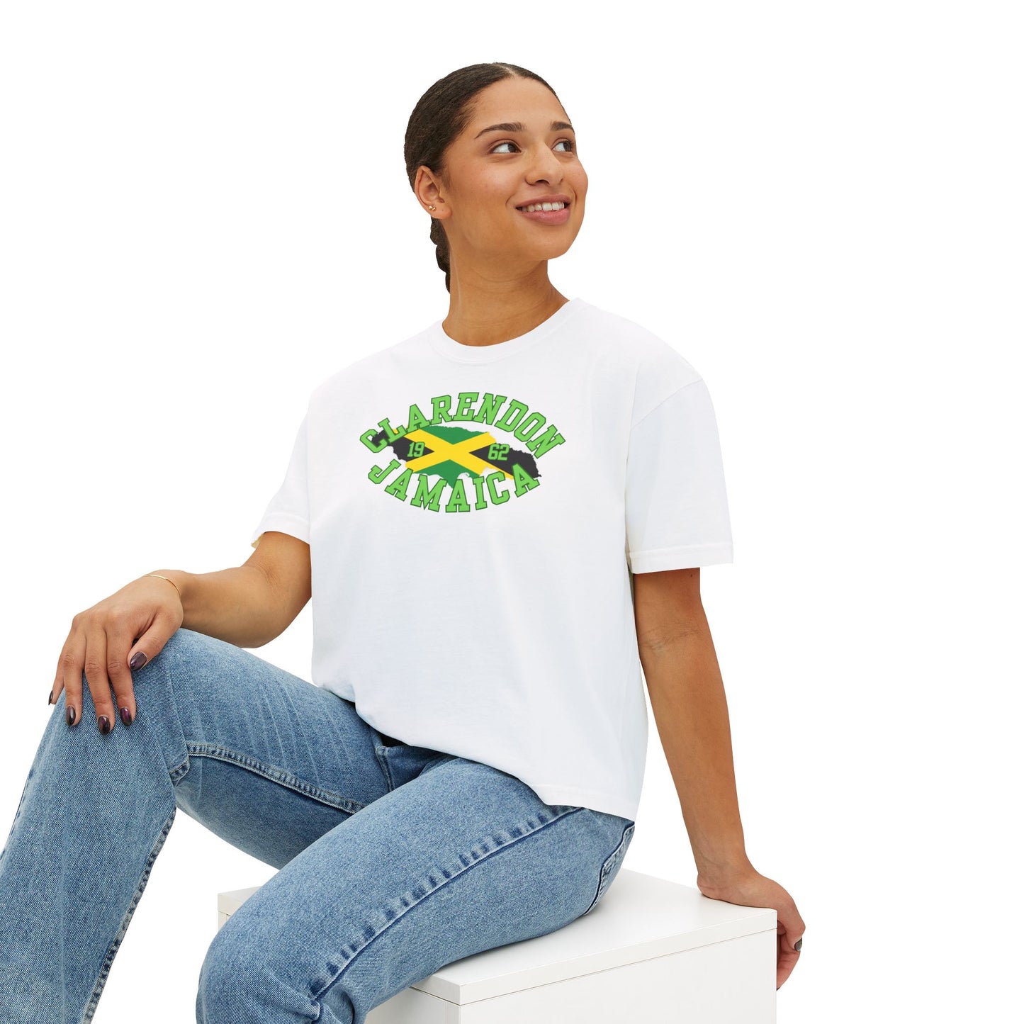 Person wearing a white t-shirt with 'Clarendon Jamaica' text and logo on a white background