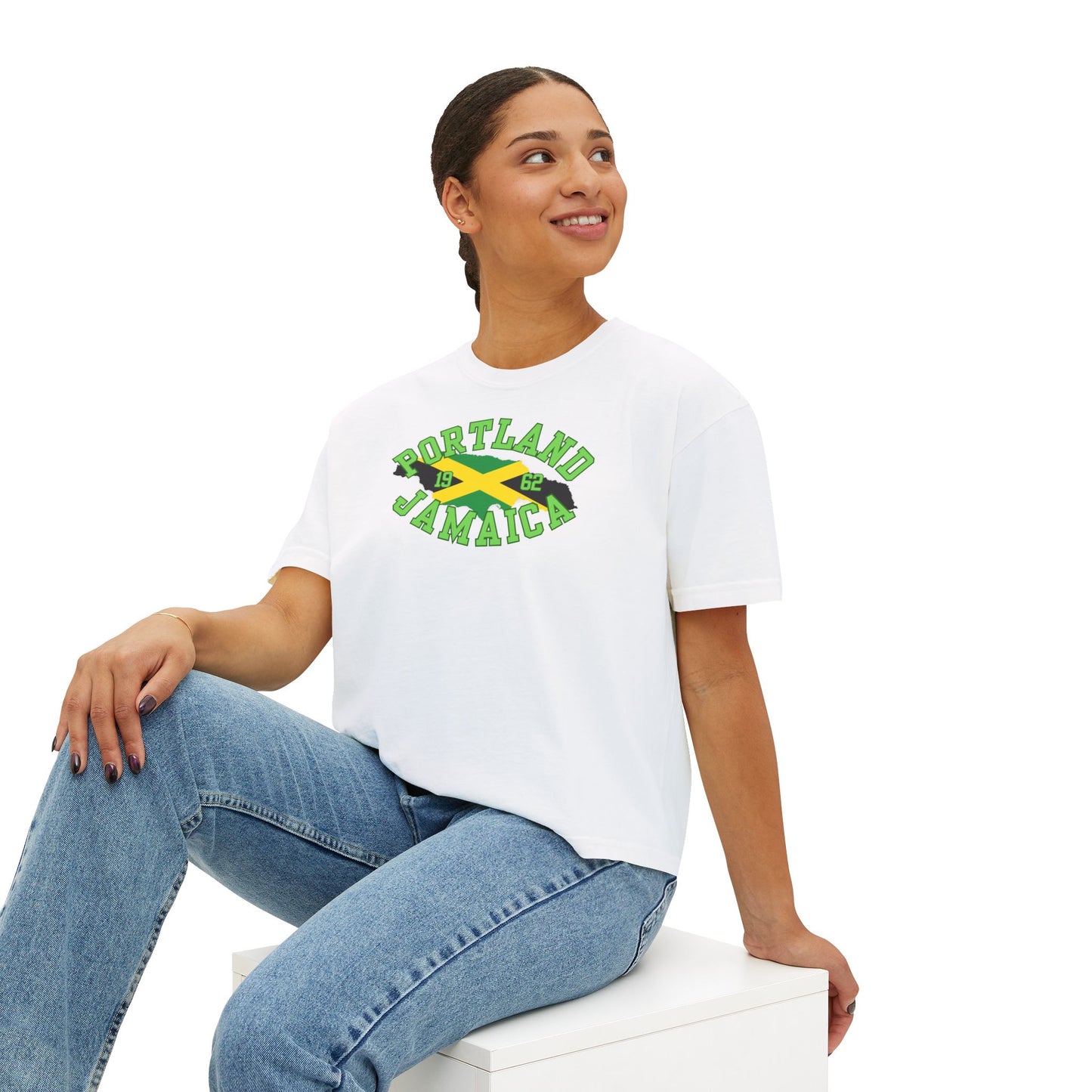 Seated woman wearing a white t-shirt with 'Portland Jamaica' design on a white background
